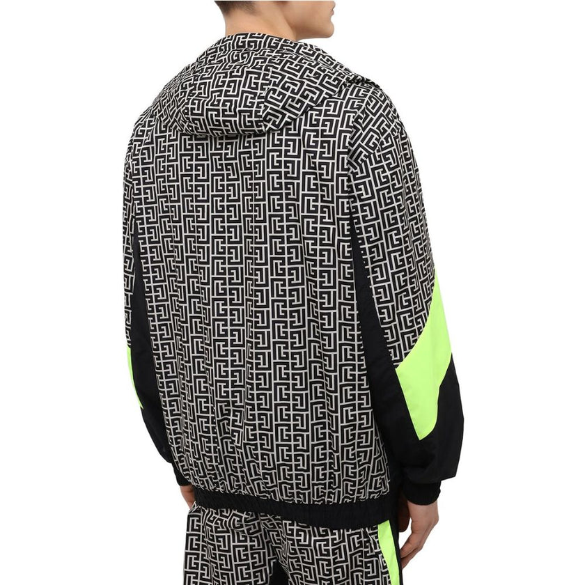 Multicolor Nylon Men JacketElevate your outerwear with this striking Balmain nylon jacket, showcasing a bold geometric pattern print that commands attention. Neon yellow stripes race down the sides and sleeves, adding a vibrant pop of color. Function meet
