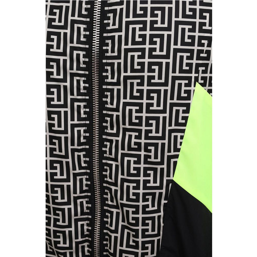 Multicolor Nylon Men JacketElevate your outerwear with this striking Balmain nylon jacket, showcasing a bold geometric pattern print that commands attention. Neon yellow stripes race down the sides and sleeves, adding a vibrant pop of color. Function meet