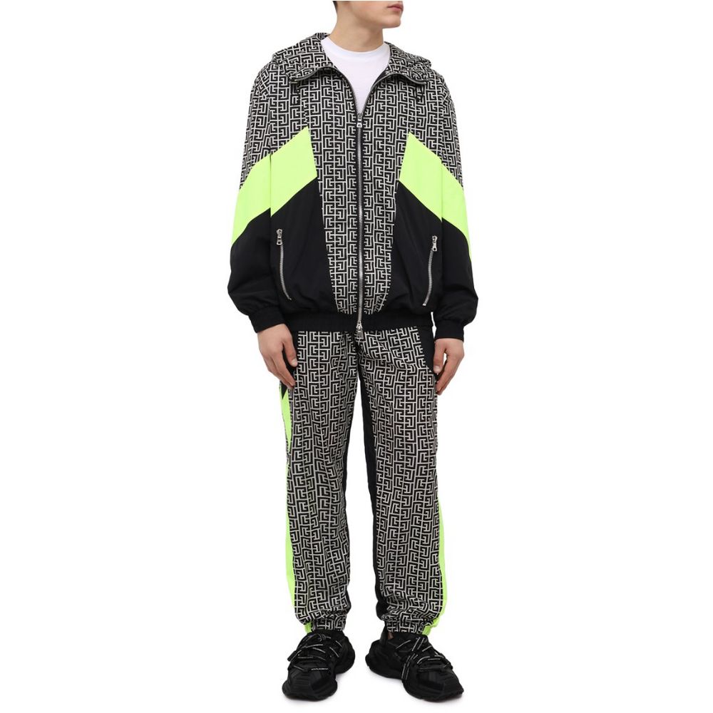 Multicolor Nylon Men JacketElevate your outerwear with this striking Balmain nylon jacket, showcasing a bold geometric pattern print that commands attention. Neon yellow stripes race down the sides and sleeves, adding a vibrant pop of color. Function meet