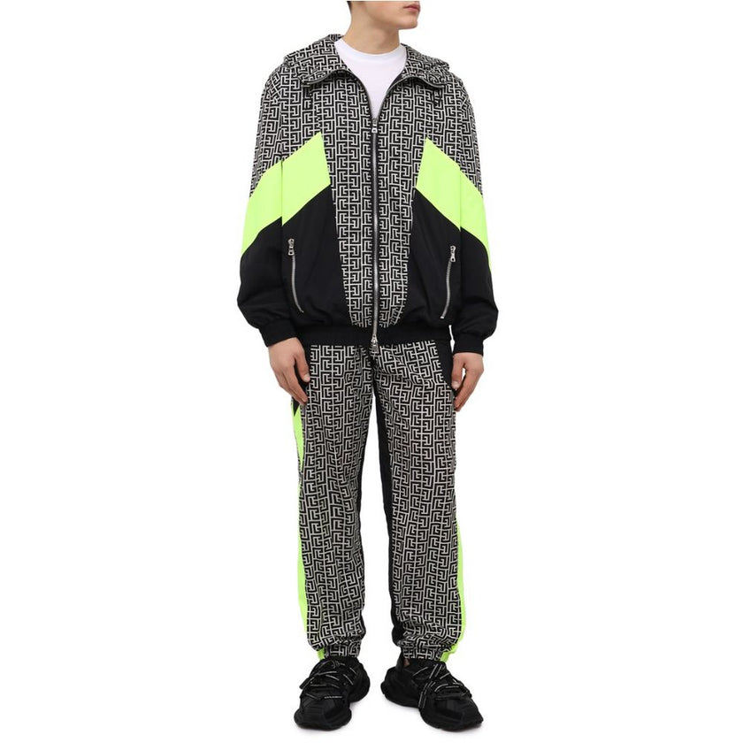 Multicolor Nylon Men JacketElevate your outerwear with this striking Balmain nylon jacket, showcasing a bold geometric pattern print that commands attention. Neon yellow stripes race down the sides and sleeves, adding a vibrant pop of color. Function meet