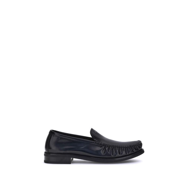 Black Calf Leather Bos Taurus Slip-On LoafersPrada’s brushed leather Loafers reinterpret a classic with a tapered, lightweight silhouette enhanced by the elegant finish of brushed leather. The refined handcrafted construction emphasizes the minimalist cha