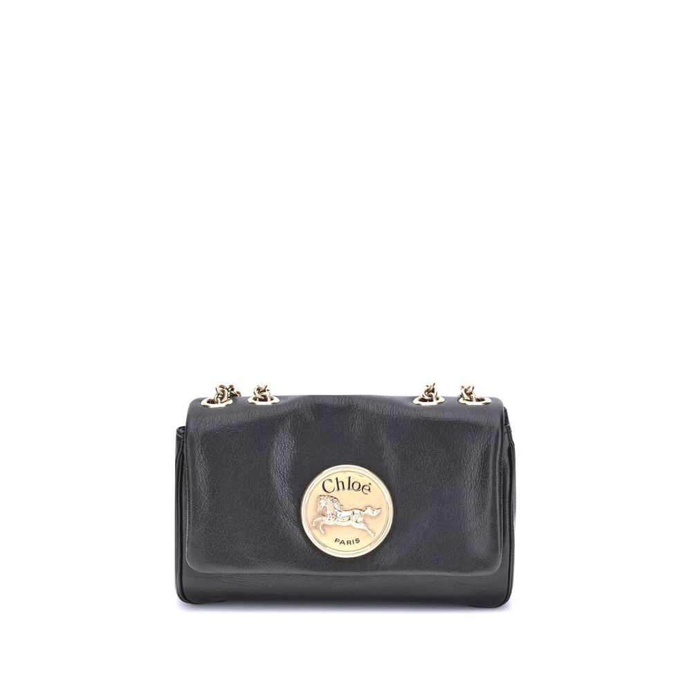 Black Calf Leather Bos Taurus Shoulder BagChloé’s Heritage Shoulder Bag is a refined and versatile accessory made of soft grained leather. Its aesthetic is embellished with a metallic logo detail on the front, underscoring its design identity. The metal c