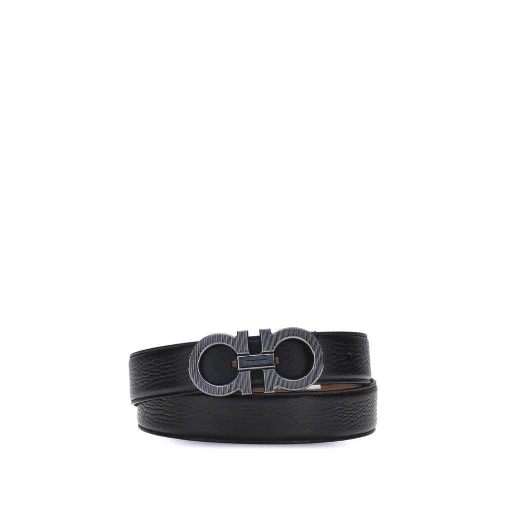 Black Calf Leather Bos Taurus Regular BeltFerragamo’s Gancini reversible Belt is an iconic accessory, featuring its distinctive Gancini buckle in a ruthenium finish. The buckle is embellished with fine vertical knurling, adding a touch of elegance. This m