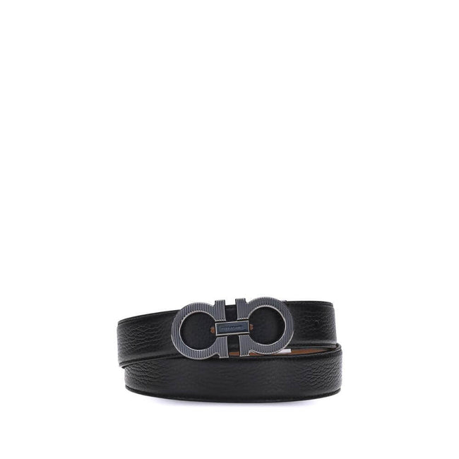 Black Calf Leather Bos Taurus Regular BeltFerragamo’s Gancini reversible Belt is an iconic accessory, featuring its distinctive Gancini buckle in a ruthenium finish. The buckle is embellished with fine vertical knurling, adding a touch of elegance. This m