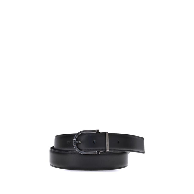 Black Calf Leather Bos Taurus BeltFerragamo’s Reversible leather Belt is a stylish and versatile accessory made from soft calfskin leather. Its two-tone reversible design offers effortless versatility, allowing you to pair it with a variety of outfits. Th
