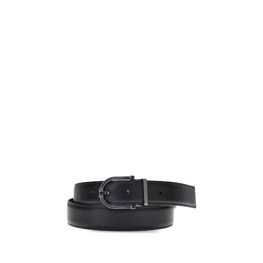 Black Calf Leather Bos Taurus BeltFerragamo’s Reversible leather Belt is a stylish and versatile accessory made from soft calfskin leather. Its two-tone reversible design offers effortless versatility, allowing you to pair it with a variety of outfits. Th
