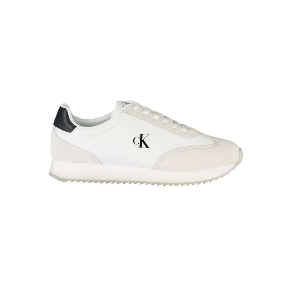 White Leather Men SneakerEmbrace the perfect fusion of comfort and style with the Calvin Klein sports sneakers. Punctuated by striking black details, these lace-ups boast a sleek silhouette complemented by a bold logo print that makes a statement on the m