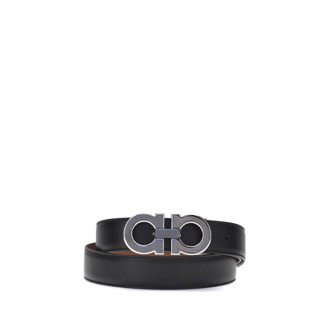 Black Calf Leather Bos Taurus Regular BeltFerragamo’s Gancini reversible Belt is a versatile and sophisticated accessory. Its topstitched shaft gives it a casual allure, while the reversible two-tone construction ensures a perfect fit for a variety of loo