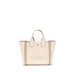 Beige Cotton Shoulder BagChloé’s Carry Tote Bag is a stylish, multifunctional accessory made of cotton with contrasting leather details that accentuate its sophisticated appeal. Magnetic buttons on the side panels allow you to adjust the width of the bag