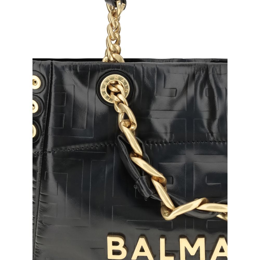 Black Calf Leather Bos Taurus Shoulder BagCracked-effect leather 1945 Small Tote Bag by Balmain features double top handles: two chain-detailed and two leather handles with chain details for a mix of style and versatility. The front features an applied me