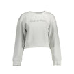 Gray Cotton Women SweaterInfuse your wardrobe with the epitome of modern chic in this Calvin Klein creation. A gray long-sleeved sweatshirt that exudes understated luxury with its sleek round neck and iconic logo detail. Perfect for the trendsetters looki