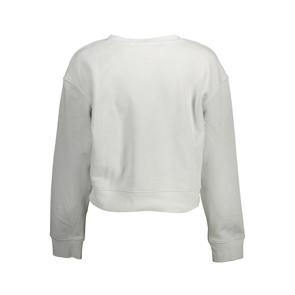 Gray Cotton Women SweaterInfuse your wardrobe with the epitome of modern chic in this Calvin Klein creation. A gray long-sleeved sweatshirt that exudes understated luxury with its sleek round neck and iconic logo detail. Perfect for the trendsetters looki