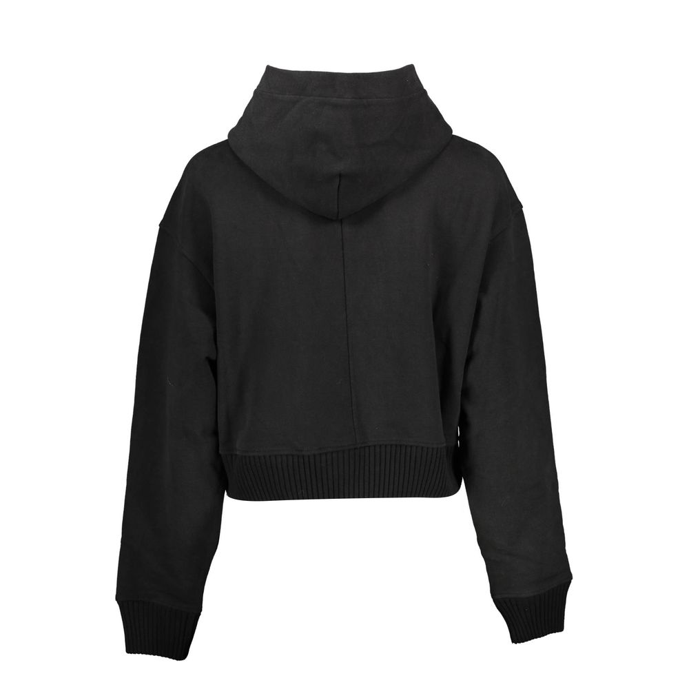 Black Cotton Women SweaterDiscover the epitome of urban sophistication with Calvin Klein’s sleek long-sleeved sweatshirt. This piece masterfully combines comfort with high-end fashion – featuring a cozy hood, striking contrasting details, and the iconic C