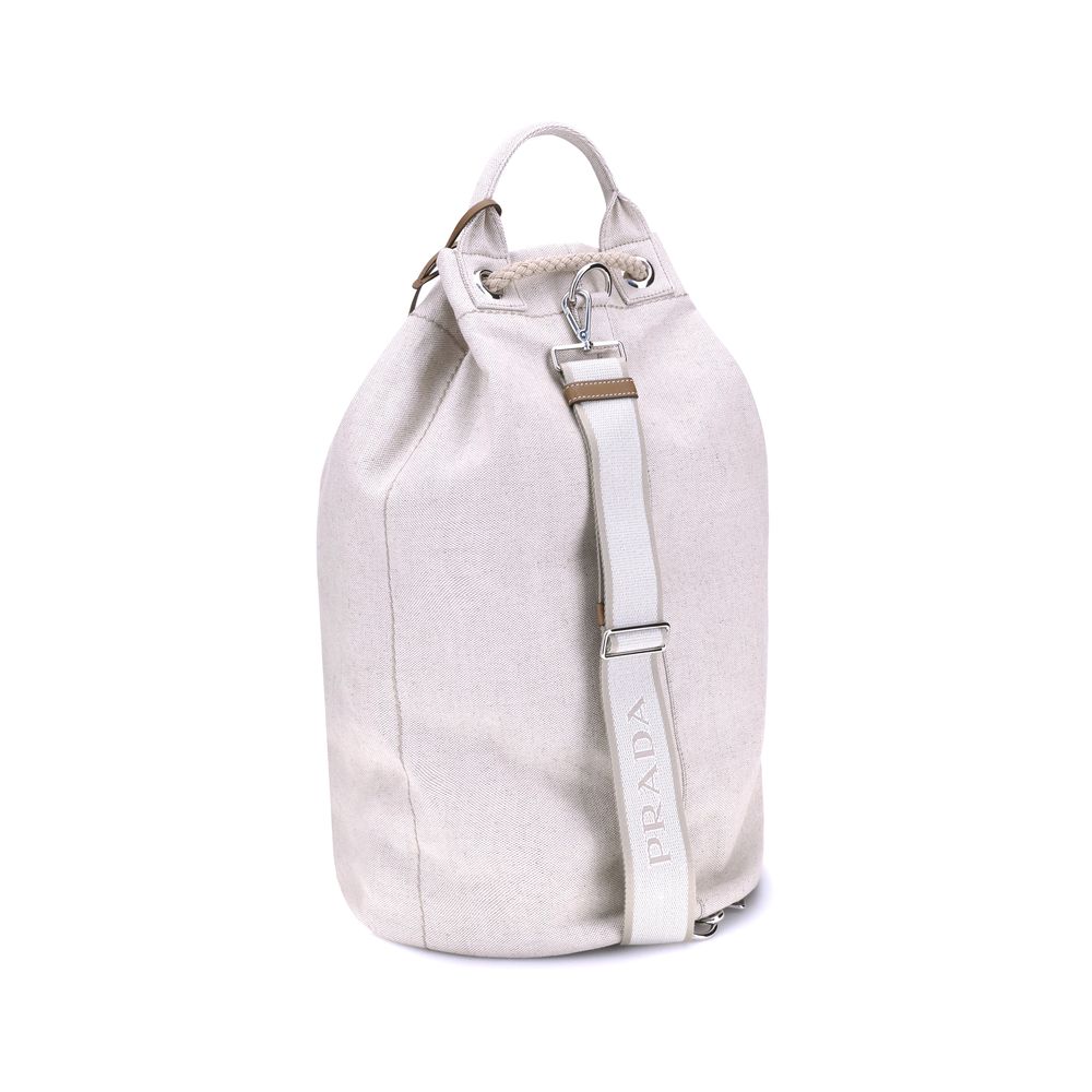 White Cotton Backet BagPrada’s Linen Bucket Bag features a lightweight design with a sporty character. It features a linen handle and an adjustable shoulder strap enhanced with leather details and the iconic tone-on-tone embroidered logo that gives the ac