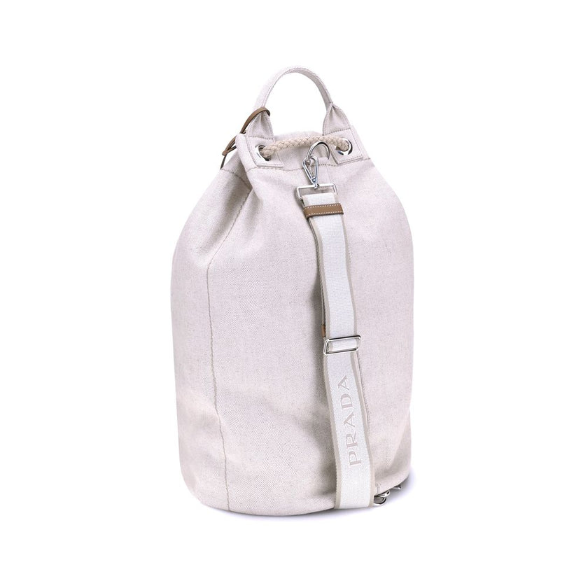 White Cotton Backet BagPrada’s Linen Bucket Bag features a lightweight design with a sporty character. It features a linen handle and an adjustable shoulder strap enhanced with leather details and the iconic tone-on-tone embroidered logo that gives the ac