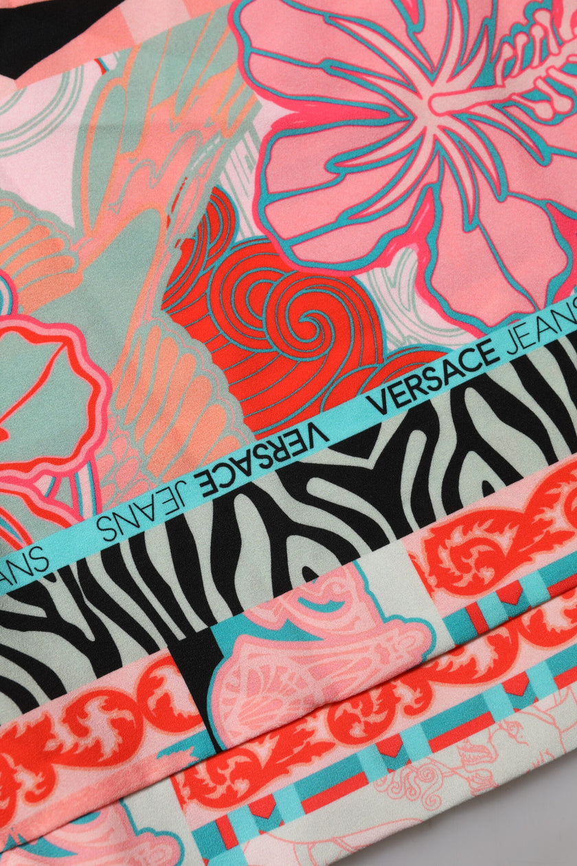 Multicolor Print Short Sleeves Women Blouse TopVERSACE JEANS Gorgeous brand new, 100% Authentic VERSACE JEANS casual short sleeves blouse. Model: Blouse top Color: Multicolor Material: 89% Polyester 11% Elastane Logo details Made in ItalyMulticolor Print