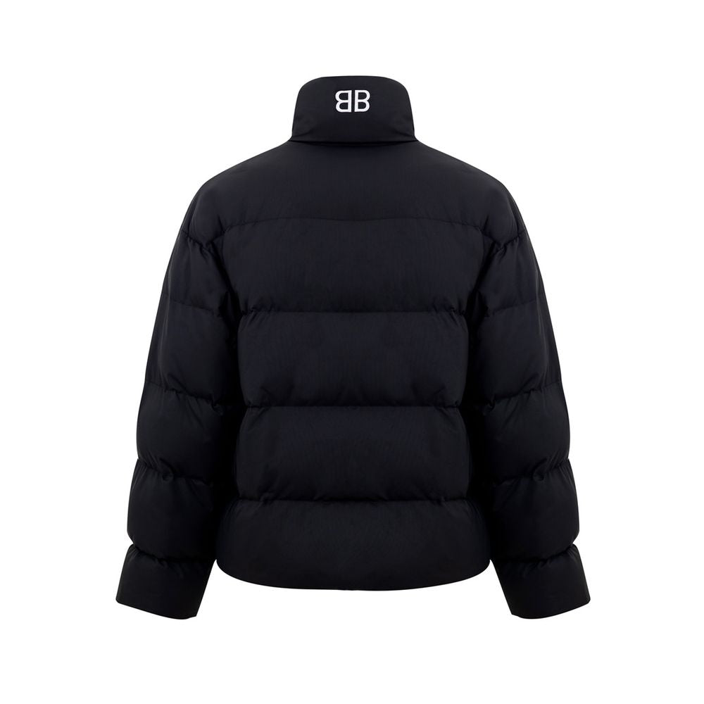 Black Polyamide Jackets & CoatBalenciaga Black Padded Puffy Jacket. Front fastening with zip and covered buttons, high collar, two side pockets closed with buttons, internal pocket with zip, elastic waist. On the back embroidered BB logo in white. Composi