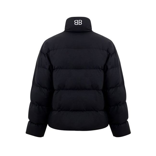Black Polyamide Jackets & CoatBalenciaga Black Padded Puffy Jacket. Front fastening with zip and covered buttons, high collar, two side pockets closed with buttons, internal pocket with zip, elastic waist. On the back embroidered BB logo in white. Composi