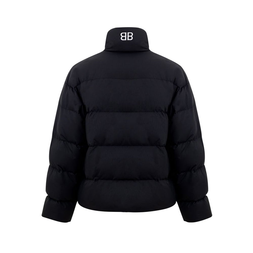 Black Polyamide Jackets & CoatBalenciaga Black Padded Puffy Jacket. Front fastening with zip and covered buttons, high collar, two side pockets closed with buttons, internal pocket with zip, elastic waist. On the back embroidered BB logo in white. Composi