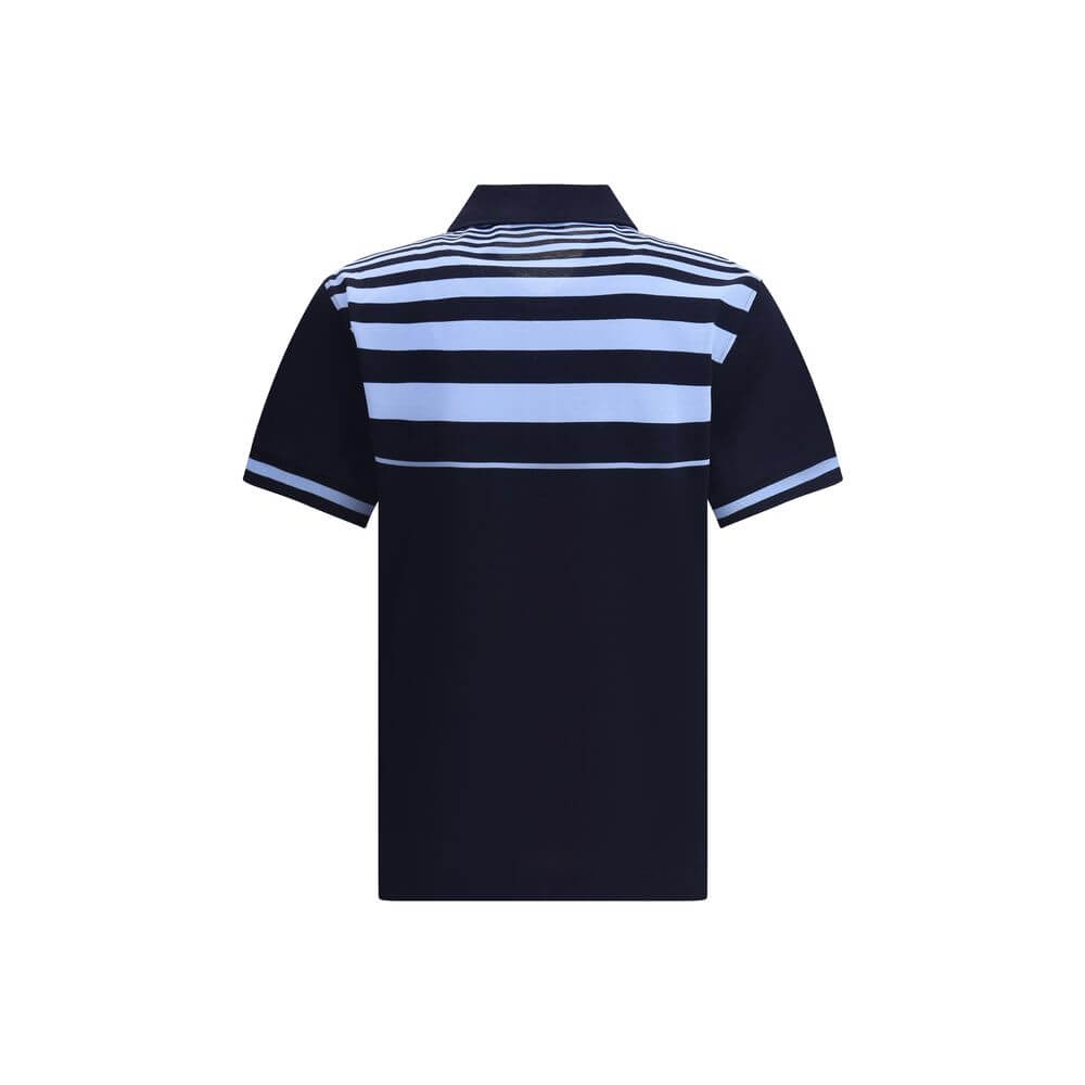 Blue Cotton Polo ShirtThe Cotton Polo Shirt by Ferragamo is a perfect balance of elegance and casual style. Featuring a classic collar and front buttons, it features a welt pocket embellished with the brand’s contrasting signature. Practical side slits an