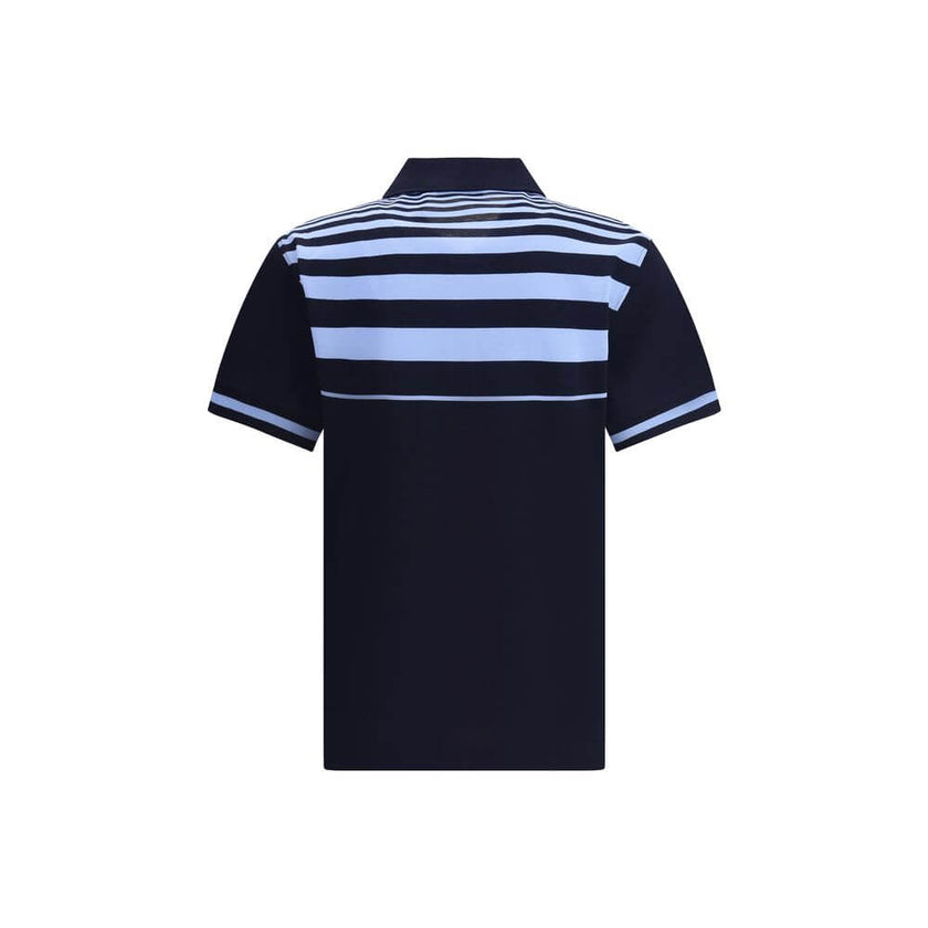 Blue Cotton Polo ShirtThe Cotton Polo Shirt by Ferragamo is a perfect balance of elegance and casual style. Featuring a classic collar and front buttons, it features a welt pocket embellished with the brand’s contrasting signature. Practical side slits an