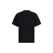 Black Cotton T-ShirtFerragamo’s cotton T-Shirt stands out for its minimal elegance and refined details. Made of soft cotton, it features a ribbed crew neck and the brand’s iconic tone-on-tone signature on the front for a discreet and sophisticated effect.