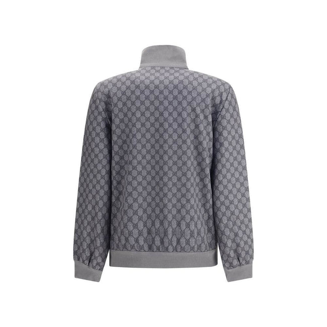 Gray Polyester SweatshirtGucci Sweatshirt with front zipper closure and ribbed high neck. The design is completed with ribbed cuffs and hem, as well as two practical side welt pockets. The iconic GG motif is repeated all-over, giving the garment a distinc
