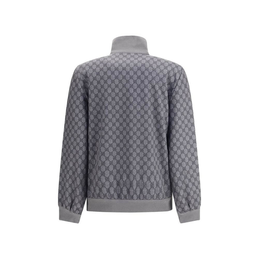 Gray Polyester SweatshirtGucci Sweatshirt with front zipper closure and ribbed high neck. The design is completed with ribbed cuffs and hem, as well as two practical side welt pockets. The iconic GG motif is repeated all-over, giving the garment a distinc