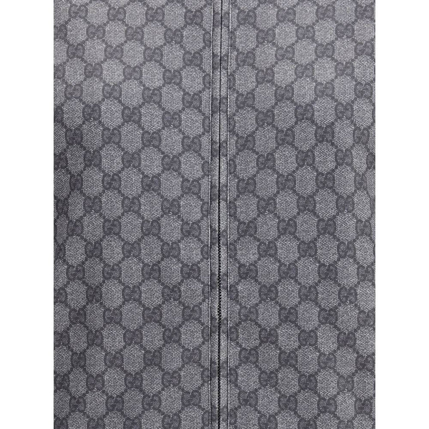 Gray Polyester SweatshirtGucci Sweatshirt with front zipper closure and ribbed high neck. The design is completed with ribbed cuffs and hem, as well as two practical side welt pockets. The iconic GG motif is repeated all-over, giving the garment a distinc