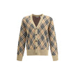 Beige Wool CardiganBurberry’s wool Cardigan is an essential piece with classic appeal, ideal for completing everyday looks with elegance. Crafted from soft wool, it features a V-neck, a front button closure and ribbed trim at the hem and cuffs for a comfo