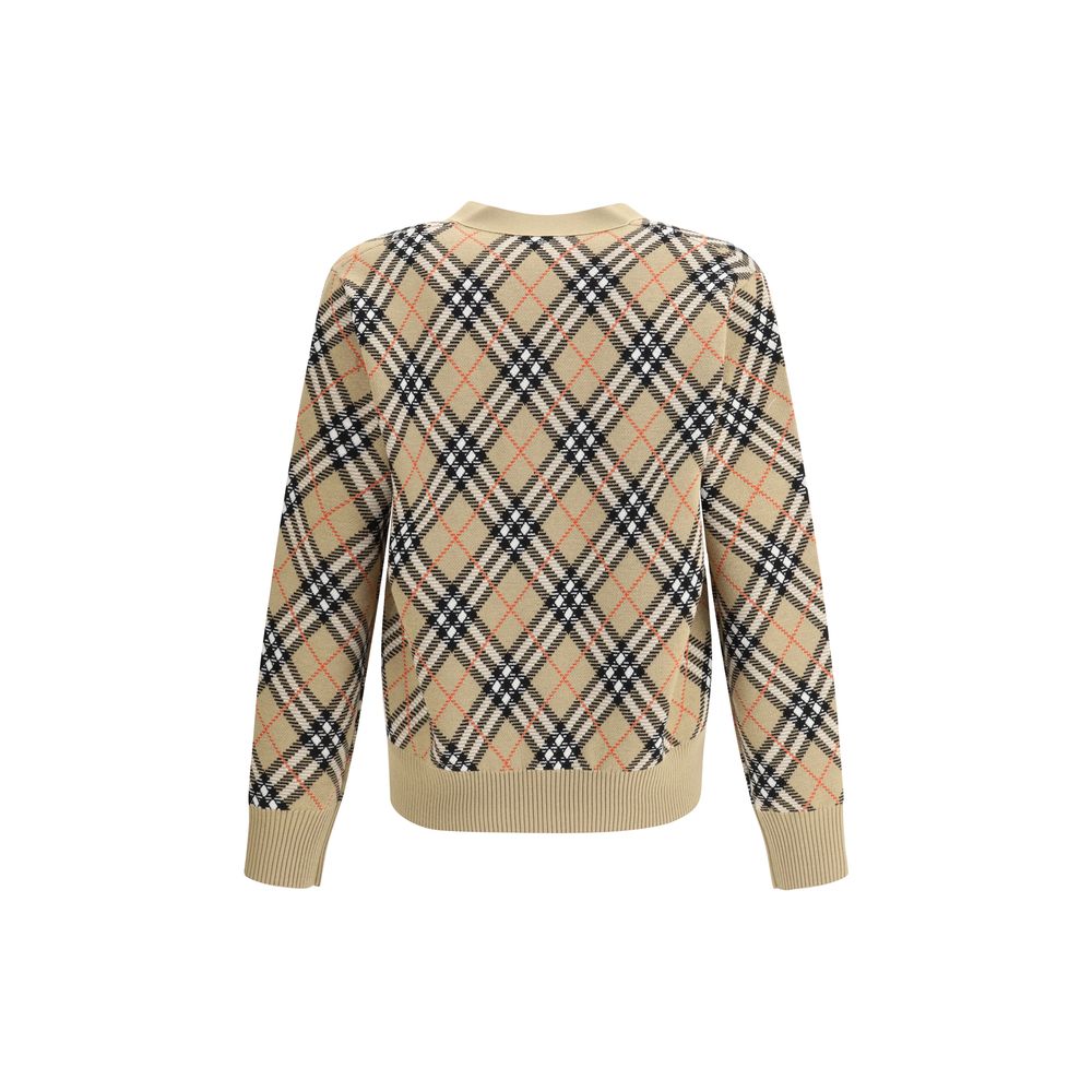 Beige Wool CardiganBurberry’s wool Cardigan is an essential piece with classic appeal, ideal for completing everyday looks with elegance. Crafted from soft wool, it features a V-neck, a front button closure and ribbed trim at the hem and cuffs for a comfo