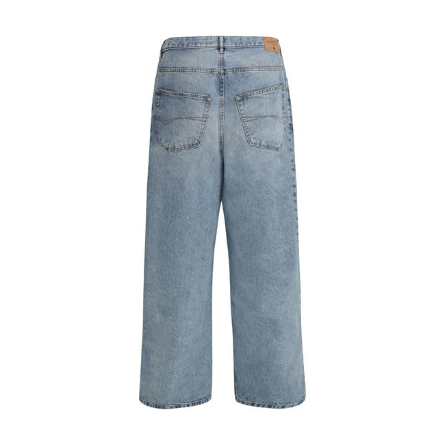 Light Blue Cotton Relaxed Fit JeansBalenciaga’s baggy Jeans feature five pockets and belt loops at the waist. A logo patch on the back completes the design, giving a distinctive touch to the urban, contemporary-inspired model. Season: AW25 Fit: Oversize C