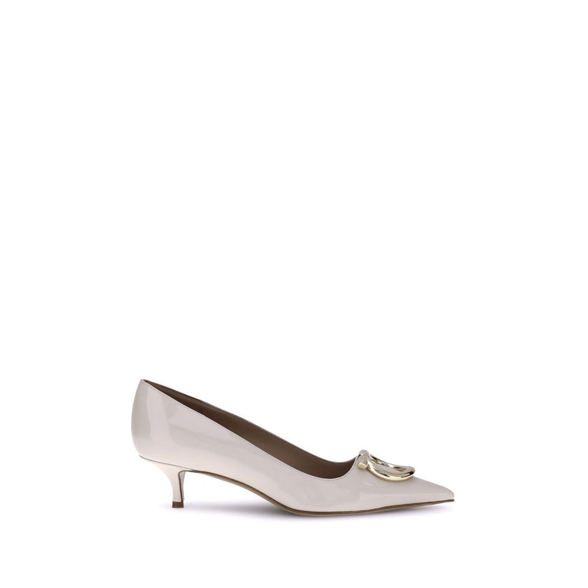 Cream Calf Leather Bos Taurus Mid Heel PumpsFerragamo’s Gancini Pumps embody sophisticated and timeless elegance. Featuring a tapered toe and a slim kitten heel covered in tone-on-tone, they feature the iconic Gancini ornament in a maxi version with a gol