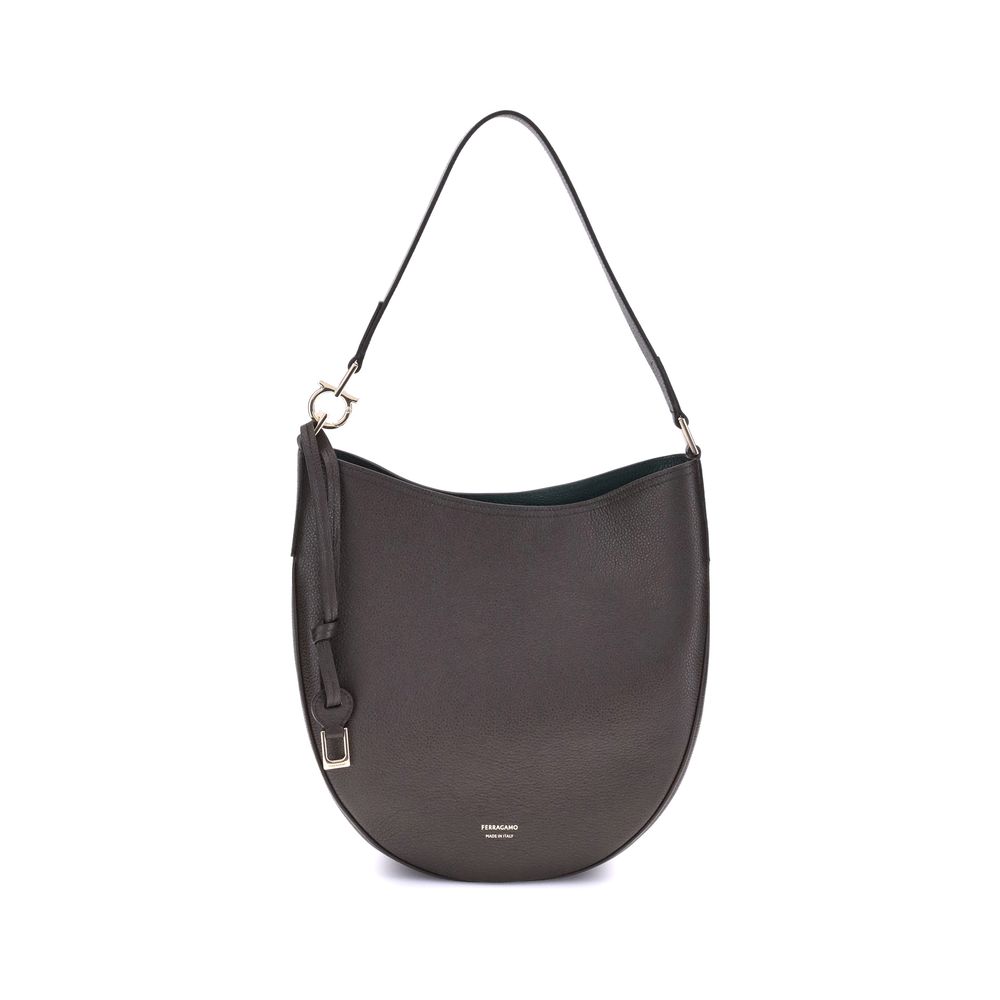 Brown Calf Leather Bos Taurus Shoulder BagFerragamo’s North-South Shoulder Bag, in its medium version, combines elegance and practicality. Made of soft hammered calfskin, it sits harmoniously on the body, ensuring comfort. The opening is secured by a meta