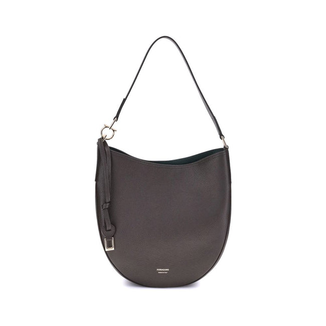 Brown Calf Leather Bos Taurus Shoulder BagFerragamo’s North-South Shoulder Bag, in its medium version, combines elegance and practicality. Made of soft hammered calfskin, it sits harmoniously on the body, ensuring comfort. The opening is secured by a meta