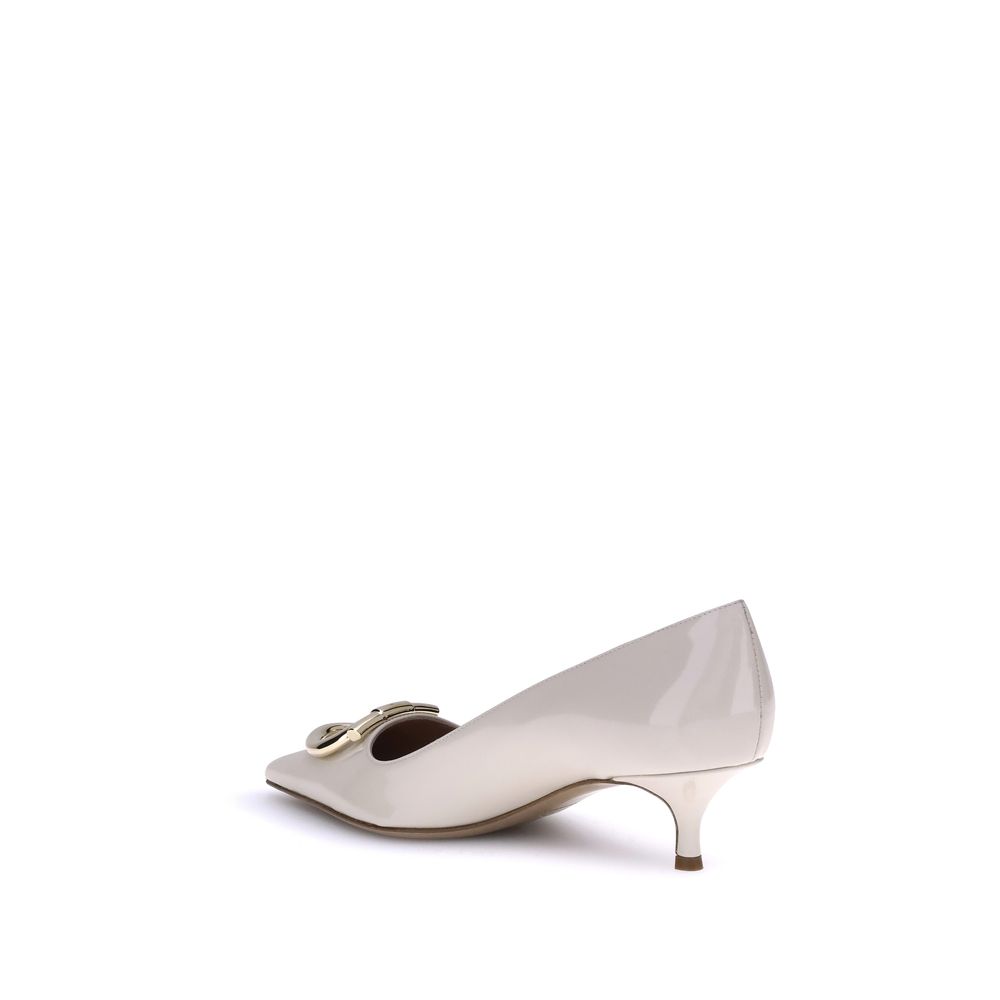 Cream Calf Leather Bos Taurus Mid Heel PumpsFerragamo’s Gancini Pumps embody sophisticated and timeless elegance. Featuring a tapered toe and a slim kitten heel covered in tone-on-tone, they feature the iconic Gancini ornament in a maxi version with a gol