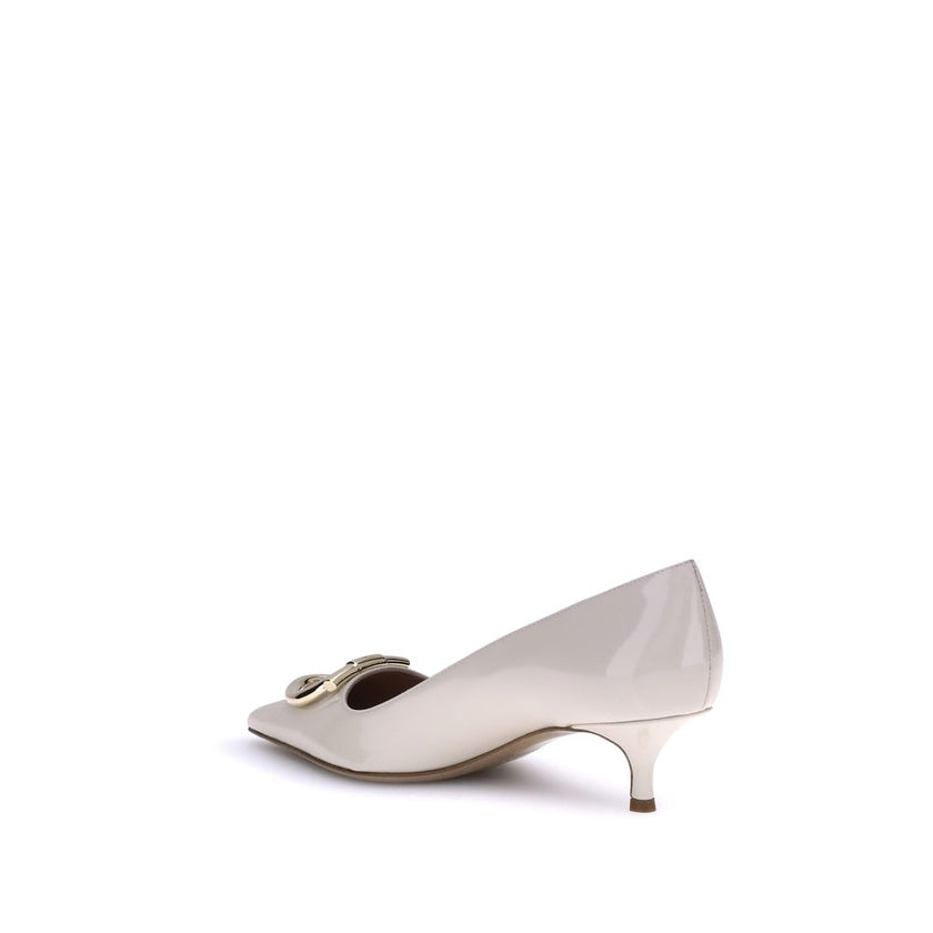 Cream Calf Leather Bos Taurus Mid Heel PumpsFerragamo’s Gancini Pumps embody sophisticated and timeless elegance. Featuring a tapered toe and a slim kitten heel covered in tone-on-tone, they feature the iconic Gancini ornament in a maxi version with a gol