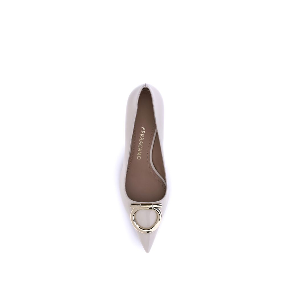 Cream Calf Leather Bos Taurus Mid Heel PumpsFerragamo’s Gancini Pumps embody sophisticated and timeless elegance. Featuring a tapered toe and a slim kitten heel covered in tone-on-tone, they feature the iconic Gancini ornament in a maxi version with a gol