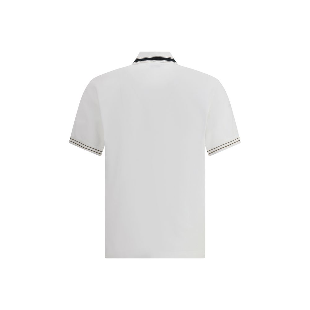 White Cotton Polo ShirtFerragamo’s Cotton Polo Shirt combines elegance with refined details. Featuring a classic collar with contrasting bands, it has a contrasting button closure and a refined embroidered monogram detail on the flap for a distinctive and