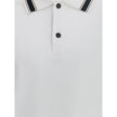 White Cotton Polo ShirtFerragamo’s Cotton Polo Shirt combines elegance with refined details. Featuring a classic collar with contrasting bands, it has a contrasting button closure and a refined embroidered monogram detail on the flap for a distinctive and