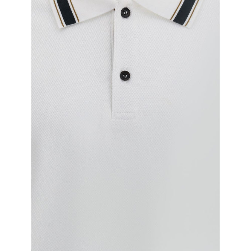 White Cotton Polo ShirtFerragamo’s Cotton Polo Shirt combines elegance with refined details. Featuring a classic collar with contrasting bands, it has a contrasting button closure and a refined embroidered monogram detail on the flap for a distinctive and