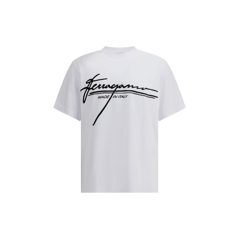 White Cotton T-ShirtFerragamo’s cotton T-Shirt is an essential piece with a clean, refined design. Featuring a ribbed crew neck, it features the brand’s iconic signature printed in contrast on the front for an understated yet distinctive look. Season: AW2