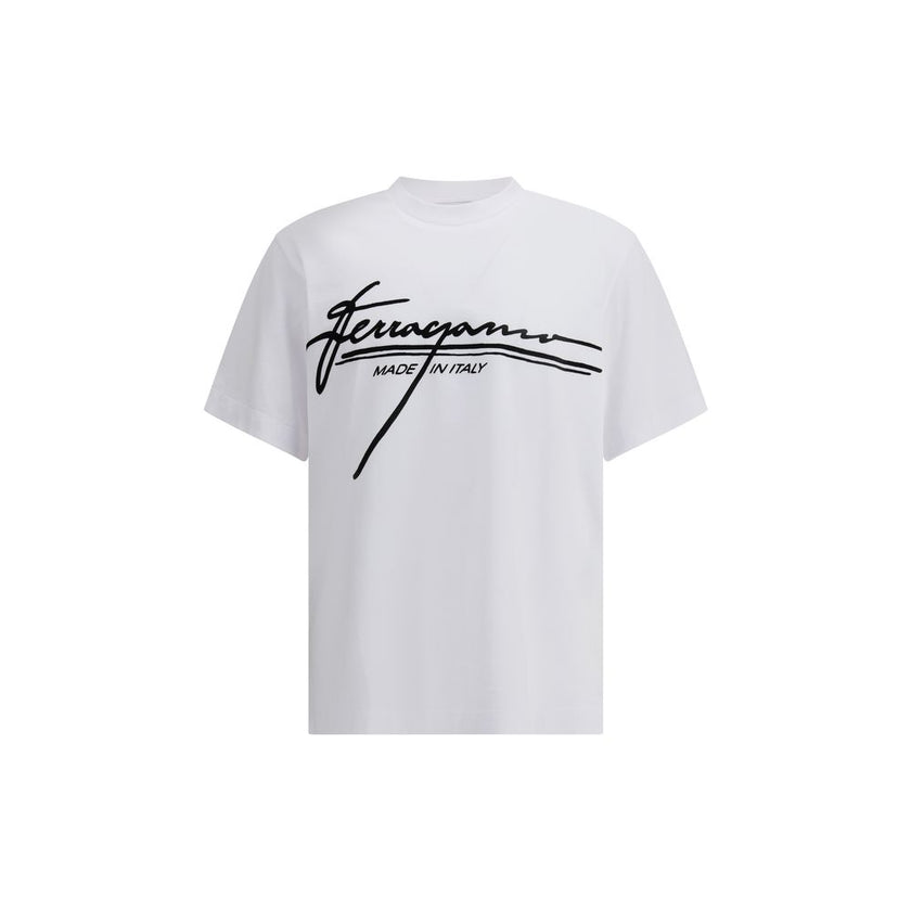 White Cotton T-ShirtFerragamo’s cotton T-Shirt is an essential piece with a clean, refined design. Featuring a ribbed crew neck, it features the brand’s iconic signature printed in contrast on the front for an understated yet distinctive look. Season: AW2