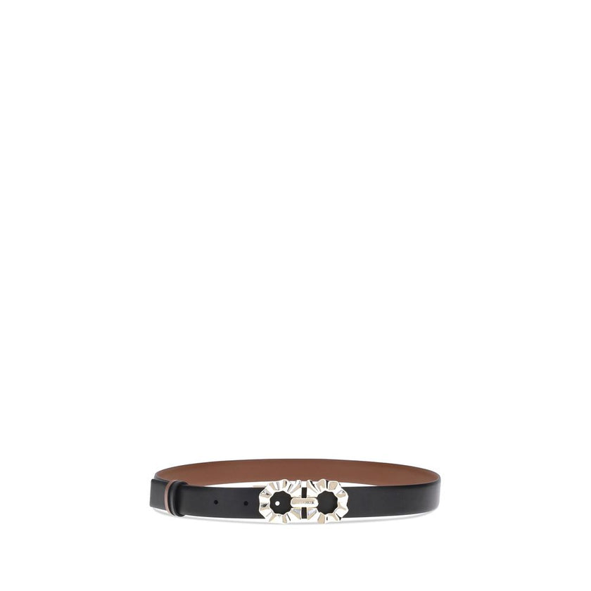Black Calf Leather Bos Taurus Regular BeltFerragamo’s Gancini reversible Belt embodies the brand’s style with delicate femininity. Its two-tone, reversible design offers unparalleled versatility, allowing you to change your look with a simple gesture. The