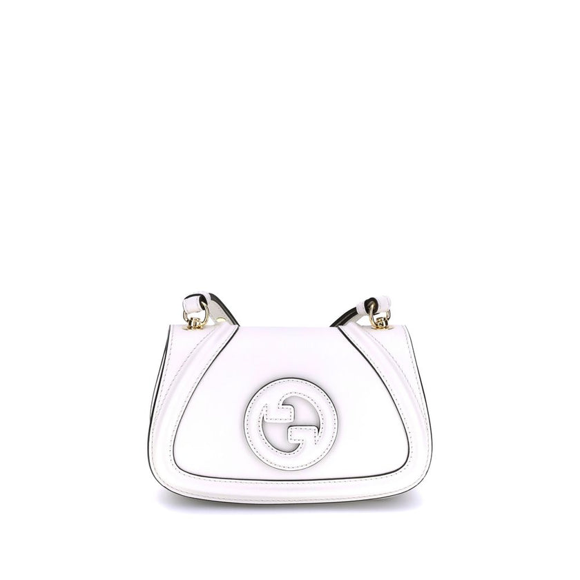 White Calf Leather Bos Taurus HandbagGucci’s Blondie Shoulder Bag is made of leather and features a stylish and functional design. It has an adjustable flat shoulder strap for optimal comfort and a magnetic flap closure on the front. On the back, a welt p