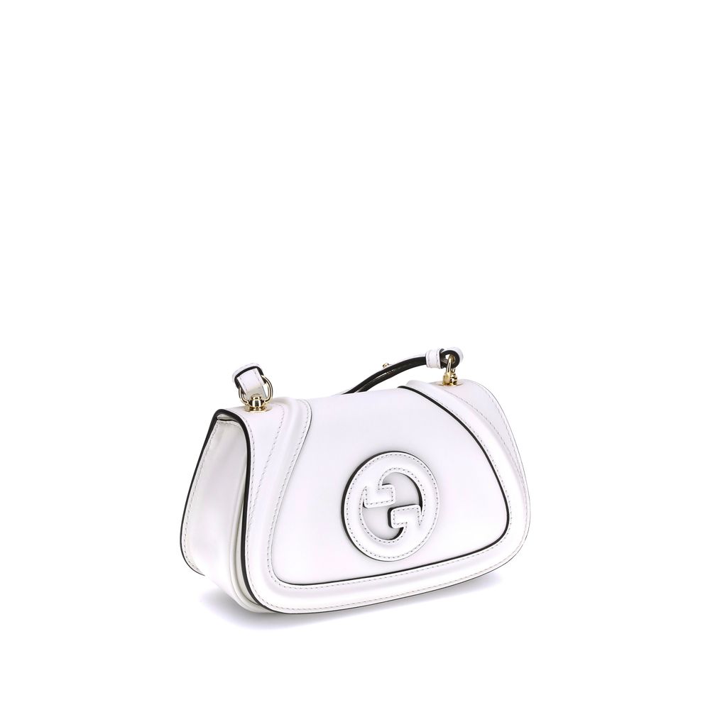 White Calf Leather Bos Taurus HandbagGucci’s Blondie Shoulder Bag is made of leather and features a stylish and functional design. It has an adjustable flat shoulder strap for optimal comfort and a magnetic flap closure on the front. On the back, a welt p
