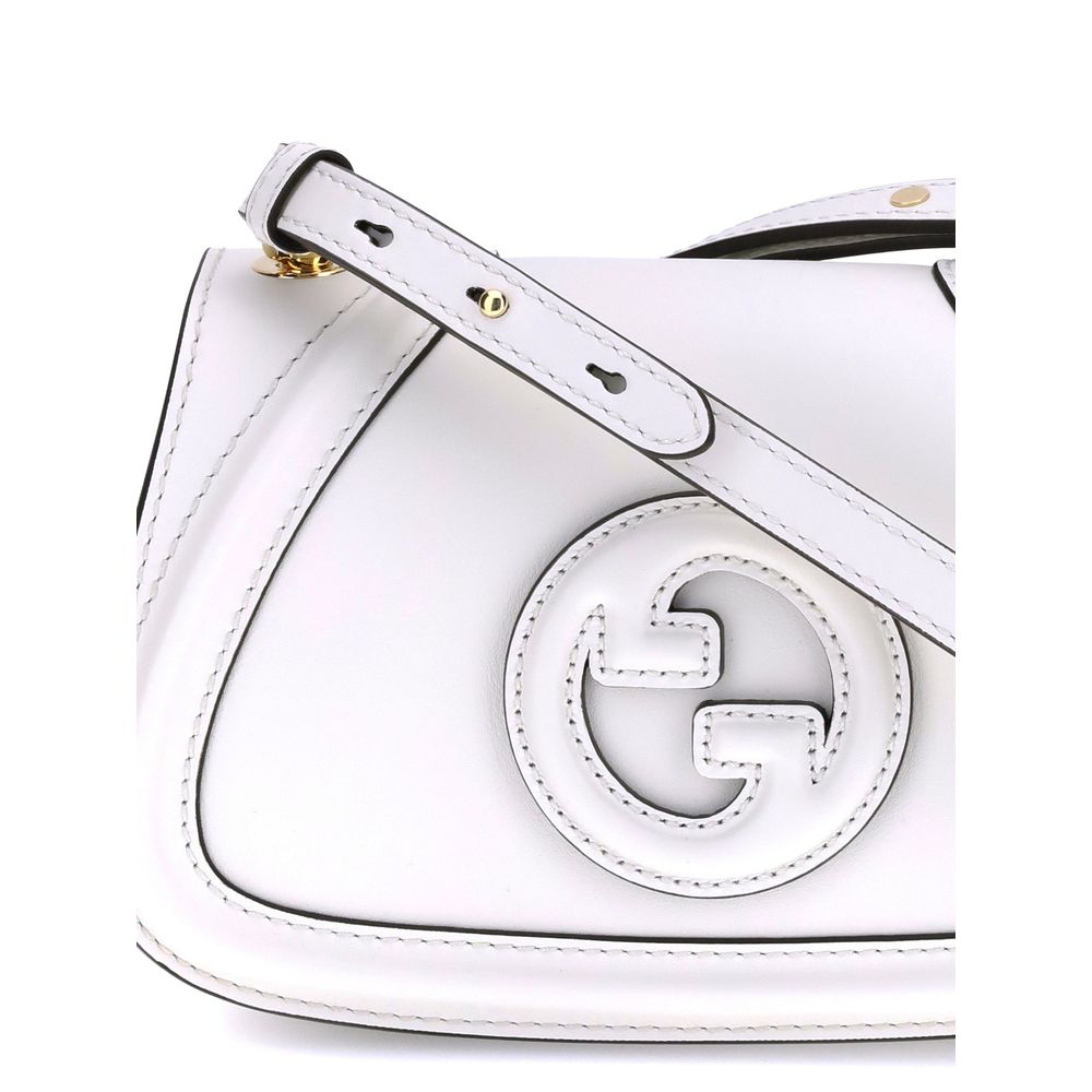 White Calf Leather Bos Taurus HandbagGucci’s Blondie Shoulder Bag is made of leather and features a stylish and functional design. It has an adjustable flat shoulder strap for optimal comfort and a magnetic flap closure on the front. On the back, a welt p