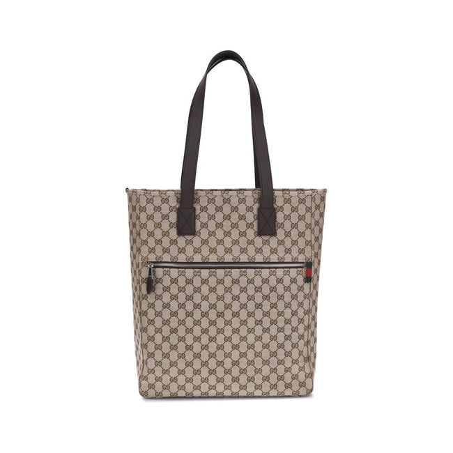 Brown Polyester HandbagGucci’s GG canvas Tote Bag is a timeless classic that combines practicality and iconic luxury. Made of the celebrated GG canvas, it is enhanced by elegant dark brown leather trim that outlines its structure. The distinctive green an