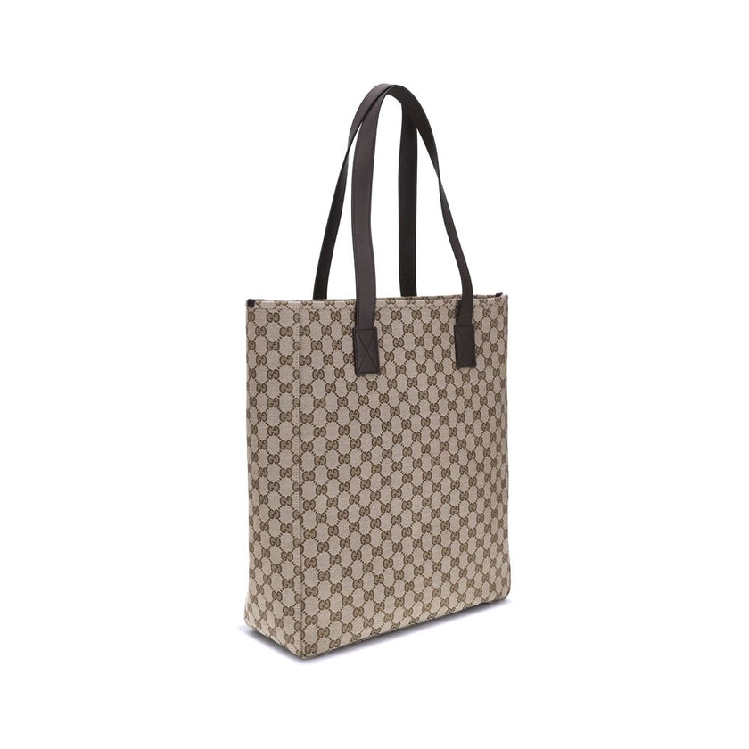 Brown Polyester HandbagGucci’s GG canvas Tote Bag is a timeless classic that combines practicality and iconic luxury. Made of the celebrated GG canvas, it is enhanced by elegant dark brown leather trim that outlines its structure. The distinctive green an