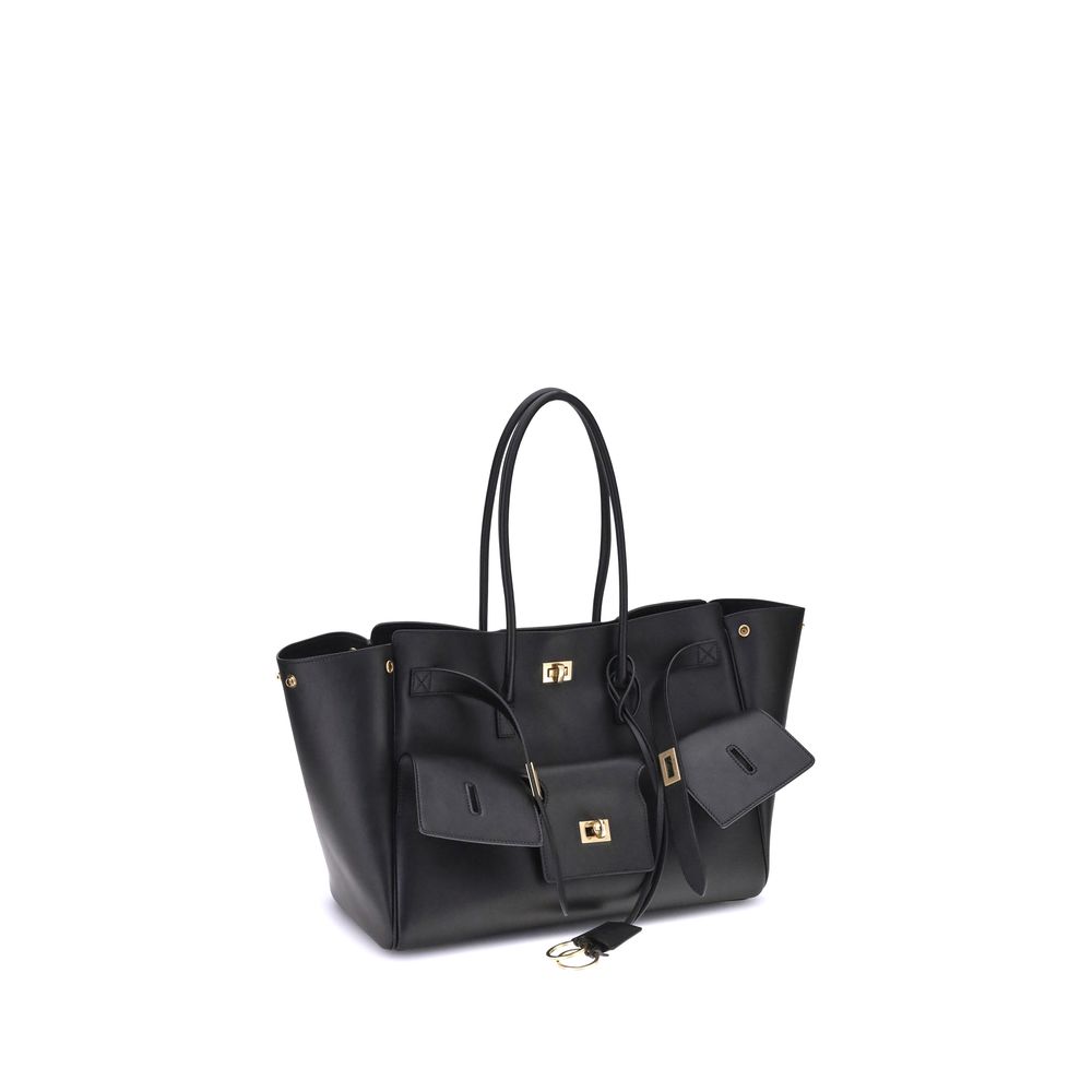 Black Calf Leather Bos Taurus Shoulder BagBalenciaga’s Bel Air medium Shoulder Bag is a spacious and functional accessory with a versatile pouch design. It features two handles for convenient carrying and the Balenciaga Paris logo embossed with silver lam